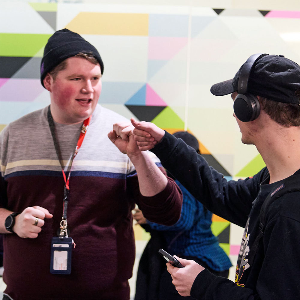 ARC Employee fist bumping an ARC client