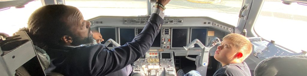 Charles River Center client in a cockpit with a pilot