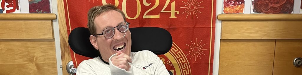 Smiling client in a wheelchair