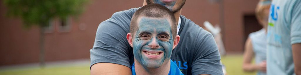 smiling man with painted face