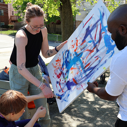 Caregivers showing art of smiling client