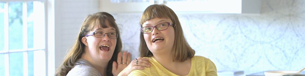 Two sister smiling together