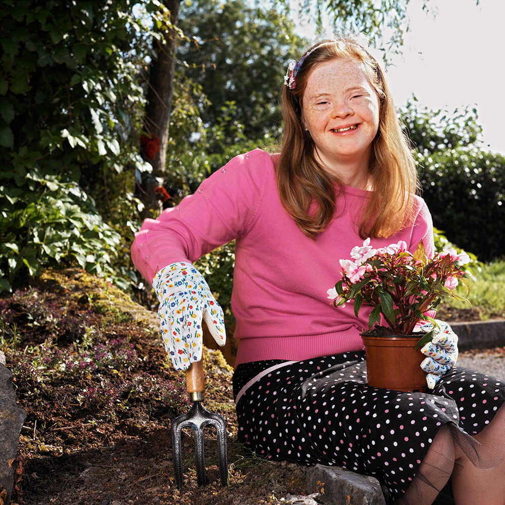 Smiling girl gardening