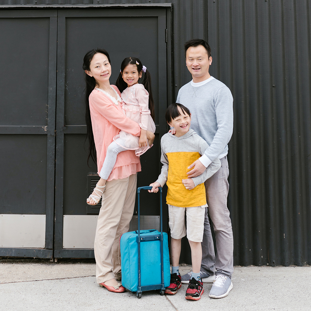 Family smiling and standing
