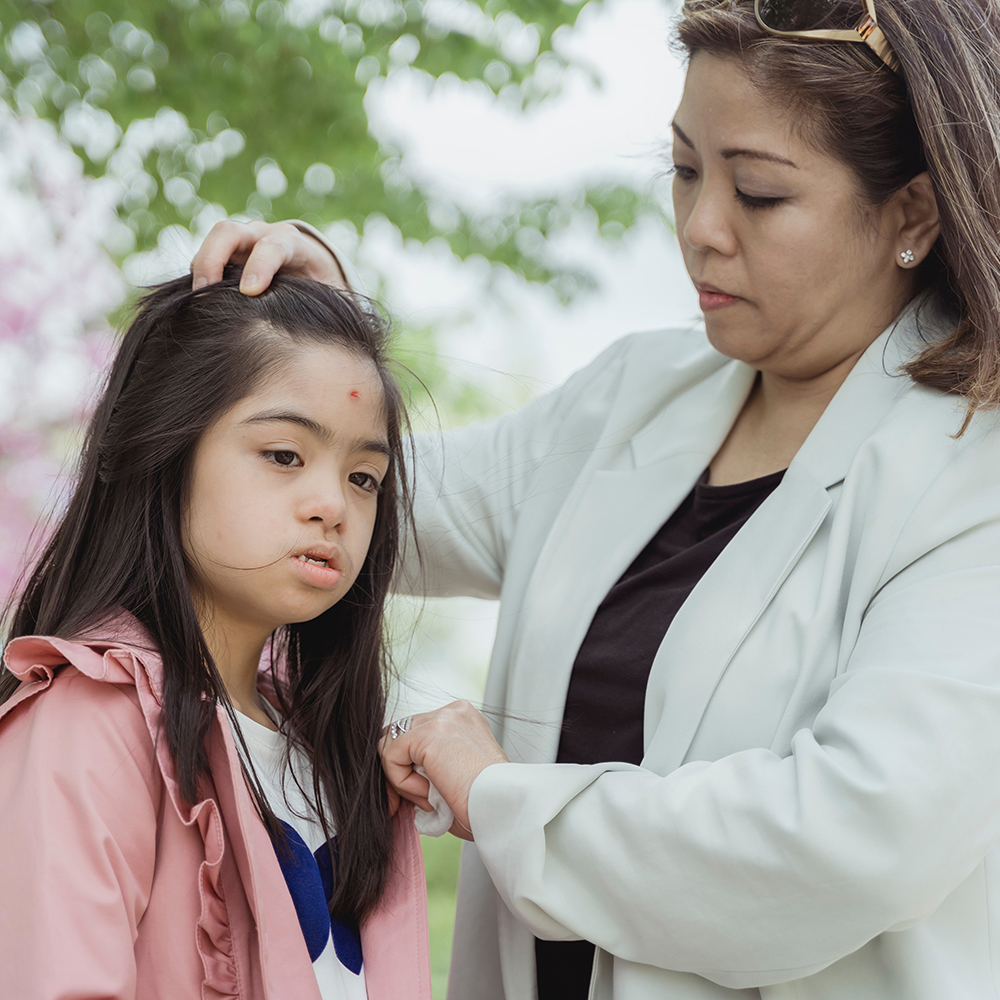 woman attending to girl